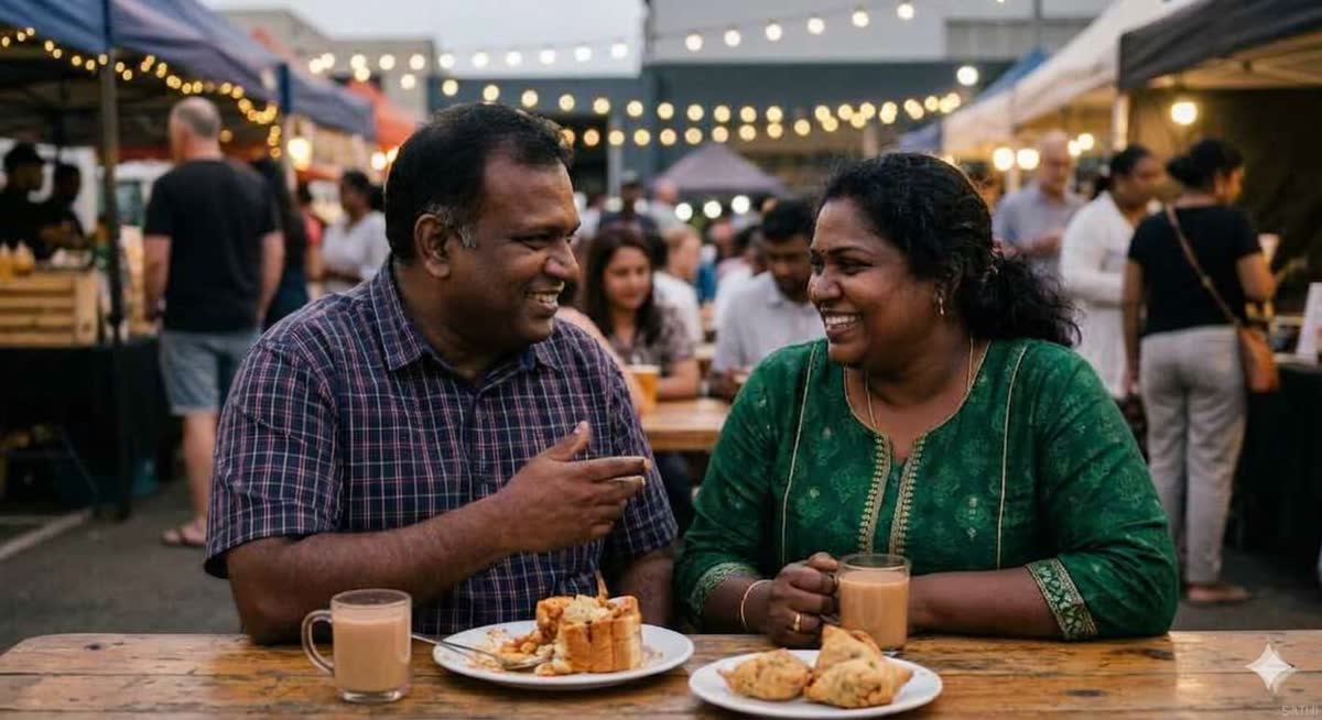 A couple sharing food under festive lights at a night market